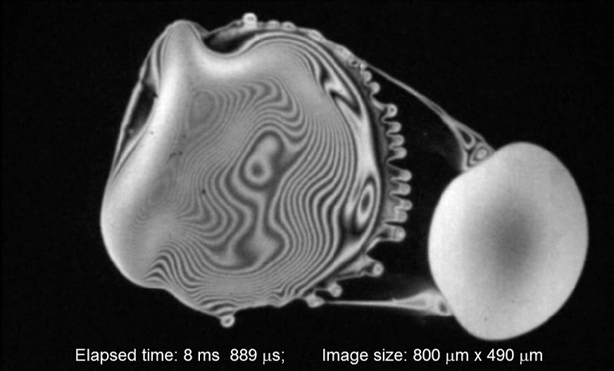 What if a picolitre ethanol drop hits a thin water film of a few microns? High speed camera caught the moment of drop impact: water film is contracted into a drop and repelled, whereas ethanol drop spreads with the development of the fingering instability at the nearside of water droplet.
